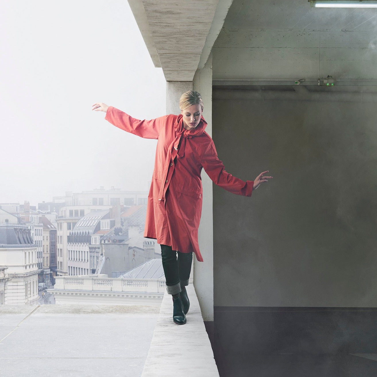 The classic raincoat - orange color - on model