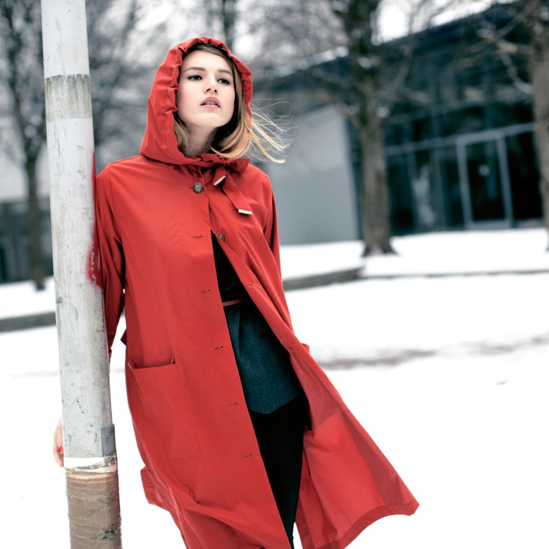 The classic raincoat - orange color - on model