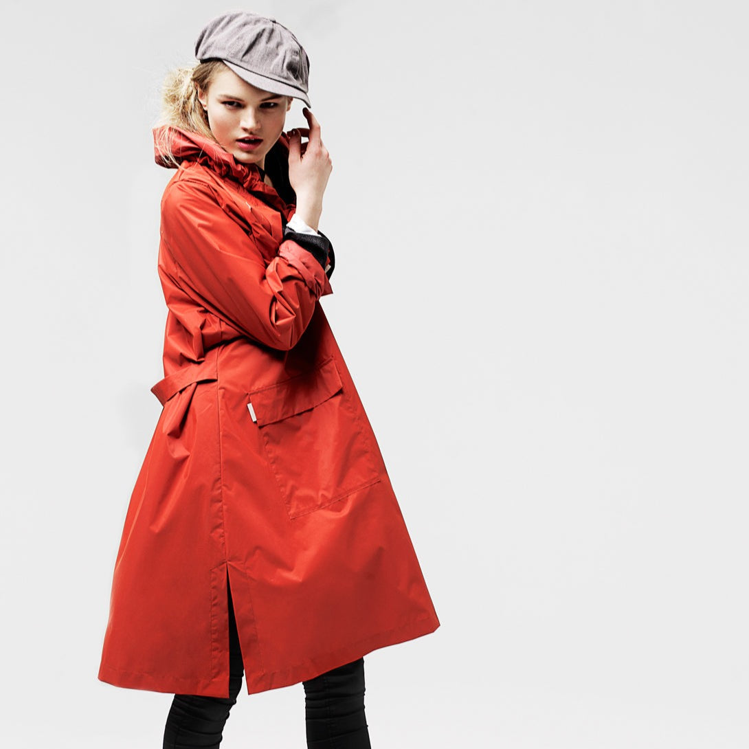 The classic raincoat - orange color - on model
